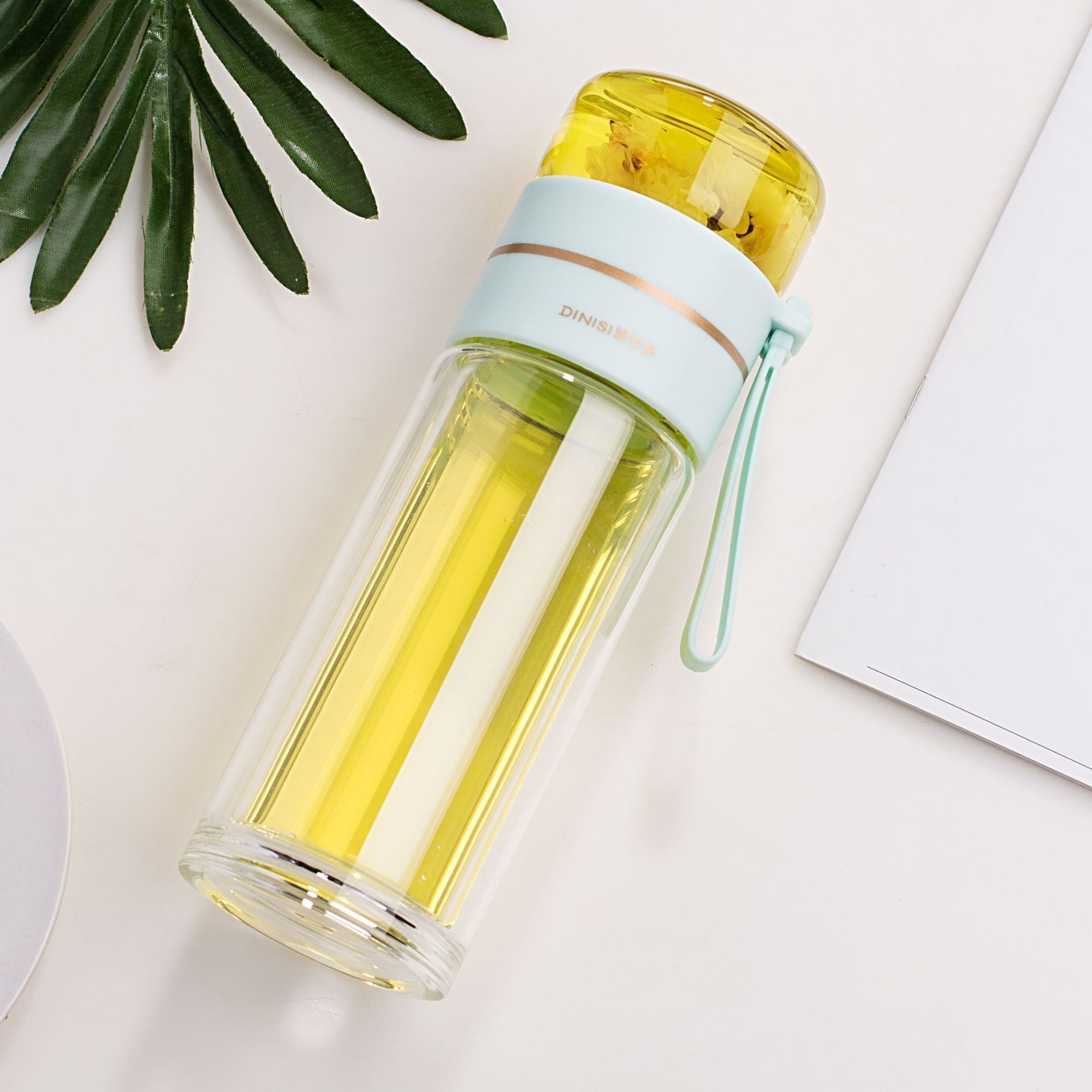 Leakproof, double-wall glass water bottle with tea infuser filter.
