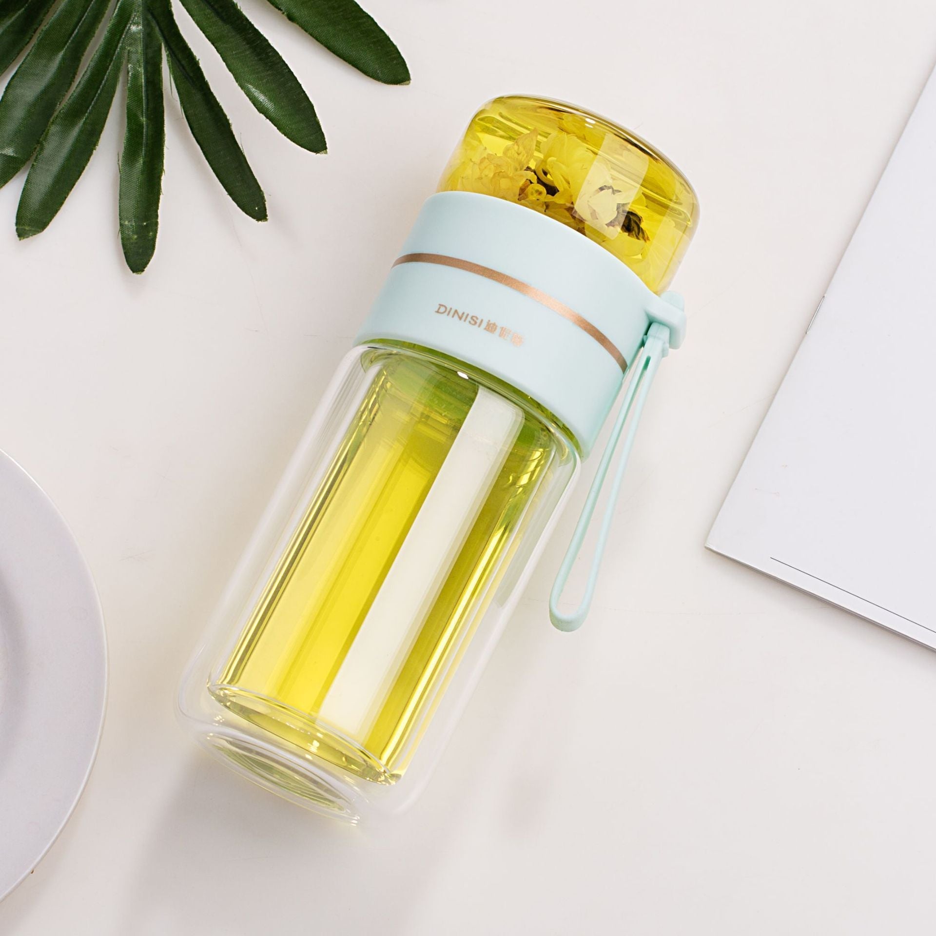 Leakproof, double-wall glass water bottle with tea infuser filter.
